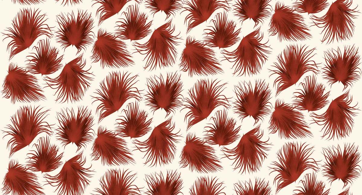Papier peint Jardin d'Alizés terracotta d'Amélie Noël représentant un motif répétitif de feuillages tropicaux aux formes graphiques.